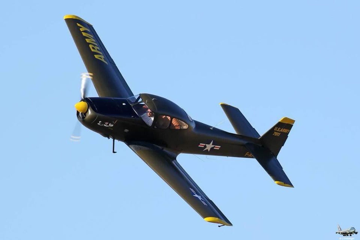 Ryan Navion G-EYVZ banking steeply against blue sky