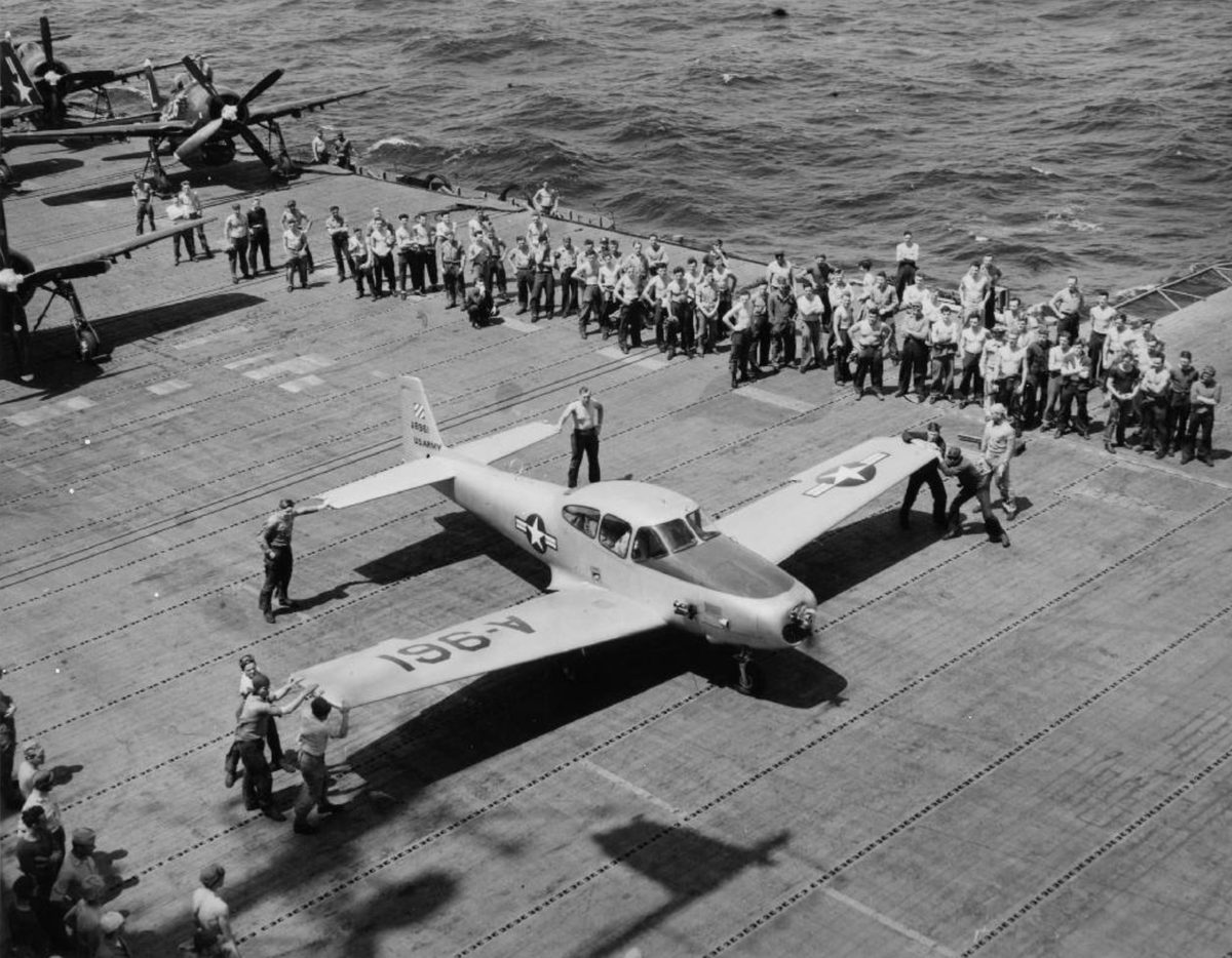 Navion L-17A on the flight deck of a U.S. Navy escort carrier